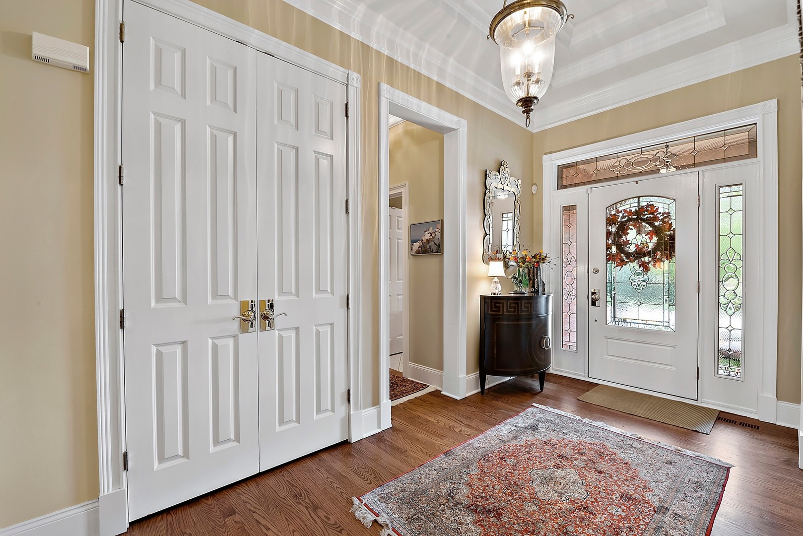 1036 Ridgeview Drive Inverness, IL 60010 - Photo 3 of 35 a view of a hallway with wooden floor and windows