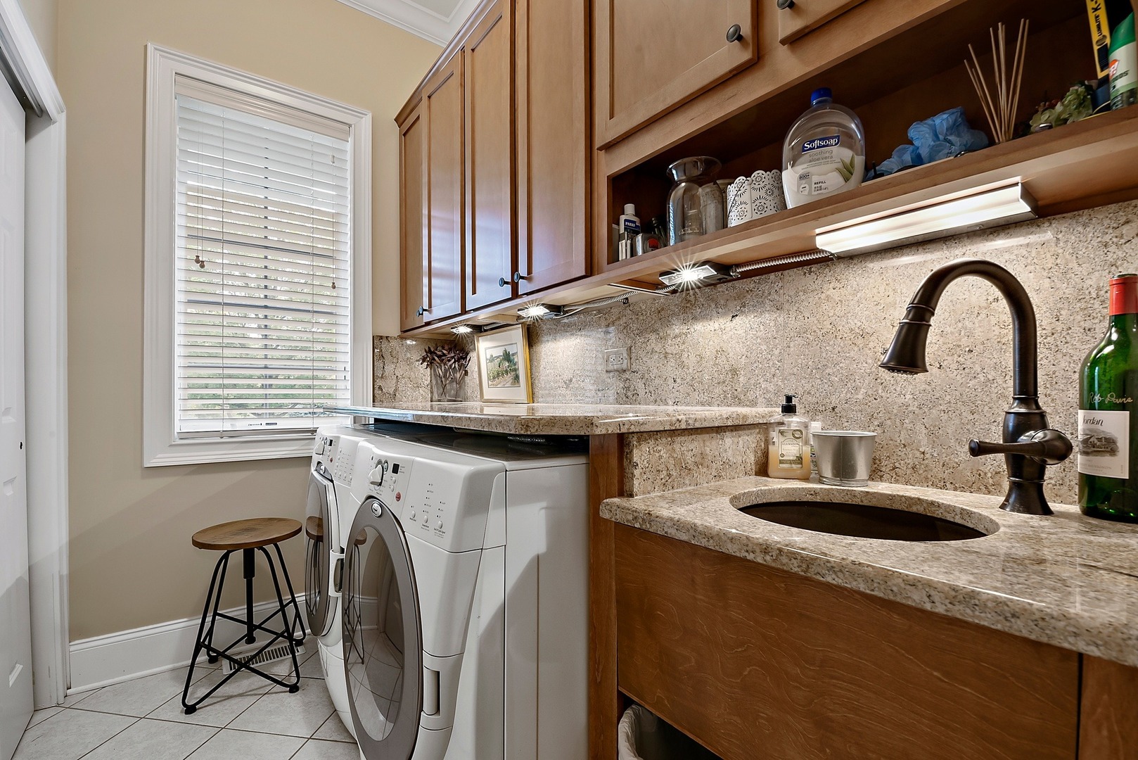 1036 Ridgeview Drive Inverness, IL 60010 - Photo 21 of 35 a kitchen with a sink a stove and a dining table chair
