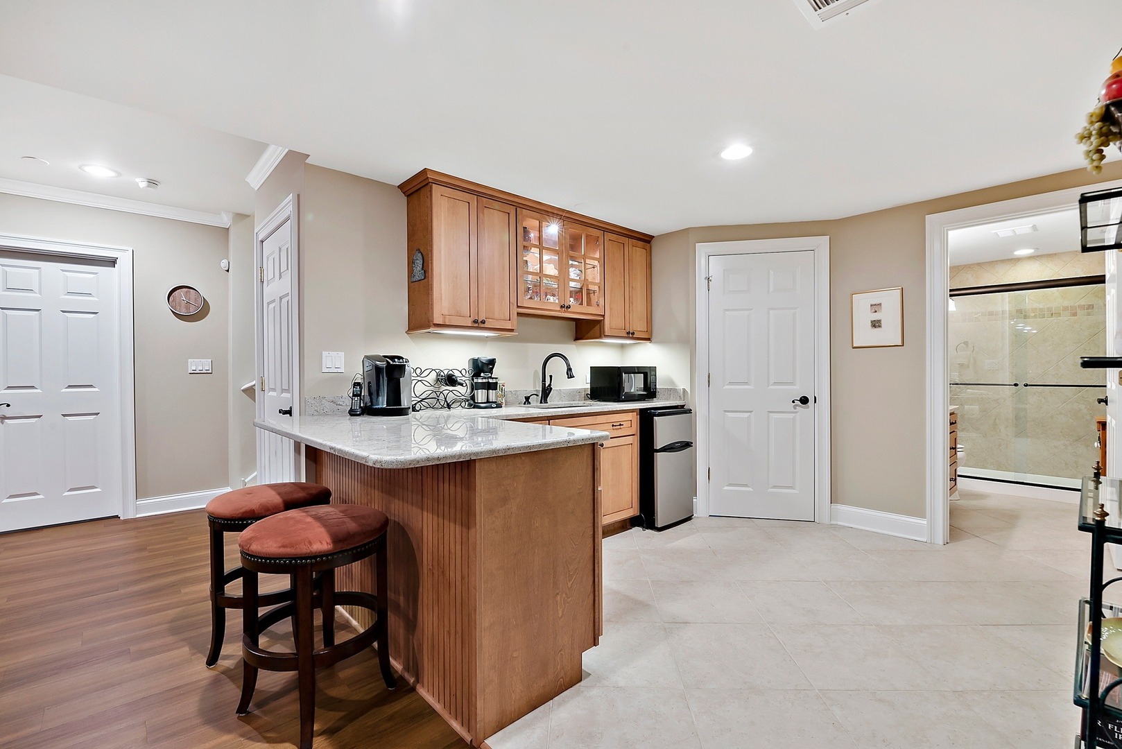1036 Ridgeview Drive Inverness, IL 60010 - Photo 26 of 35 a kitchen with stainless steel appliances granite countertop a stove a sink dishwasher and a refrigerator with wooden floor