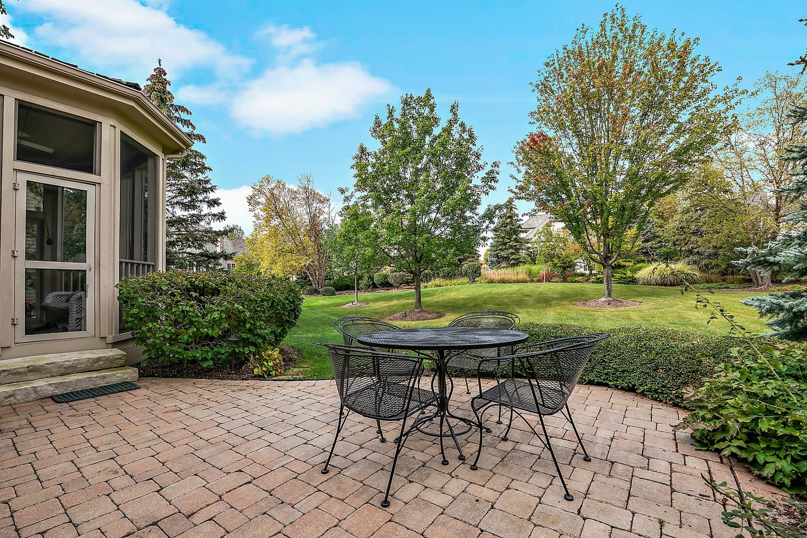 1036 Ridgeview Drive Inverness, IL 60010 - Photo 32 of 35 a view of a backyard with table and chairs and potted plants