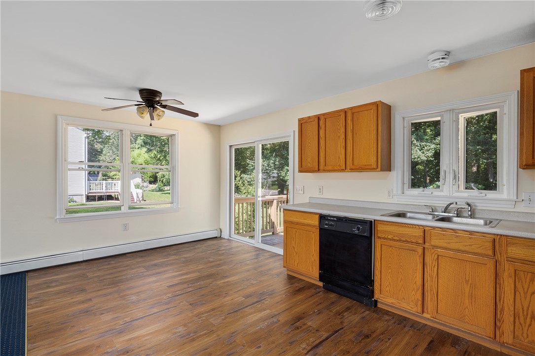 22 Jolly Lane Westerly, RI 02891 - Photo 11 of 26 Main Floor Kitchen Dining Door to Deck and Backyard