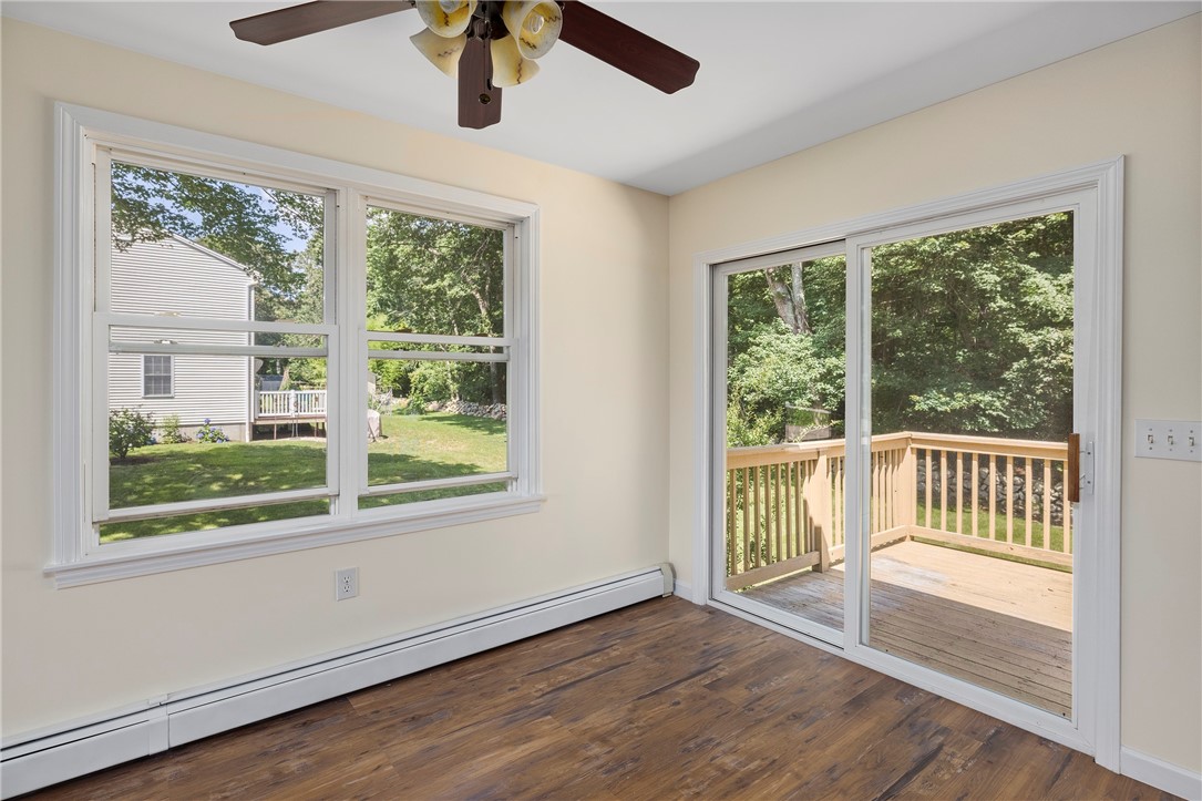 22 Jolly Lane Westerly, RI 02891 - Photo 13 of 26 Dining Room - sliding doors to rear deck & backyard