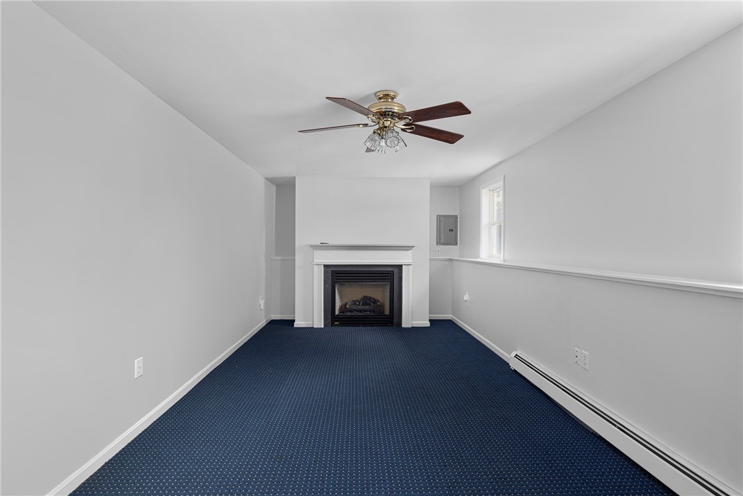 22 Jolly Lane Westerly, RI 02891 - Photo 18 of 26 Lower Level Family Room w/gas fireplace