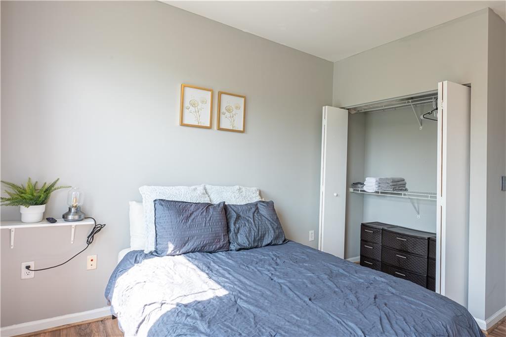 898 Oak Street Southwest, Unit 1410 Atlanta, GA 30310 - Photo 15 of 31 a bedroom with a bed and a couch