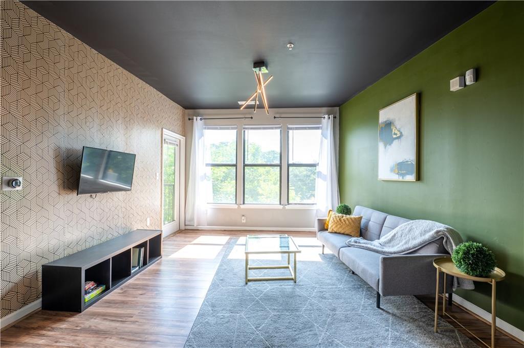 898 Oak Street Southwest, Unit 1410 Atlanta, GA 30310 - Photo 16 of 31 a living room with furniture and a flat screen tv