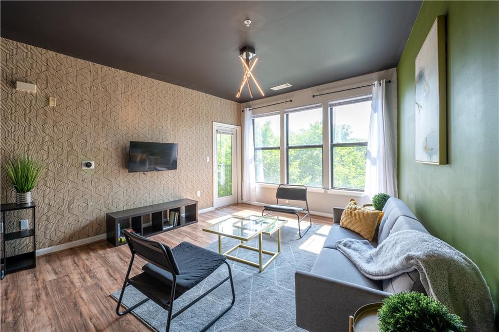 898 Oak Street Southwest, Unit 1410 Atlanta, GA 30310 - Photo 4 of 31 a living room with furniture and a flat screen tv