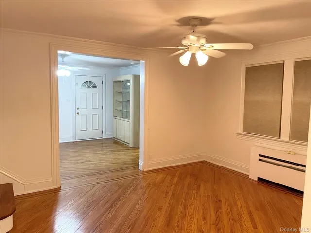 a view of a livingroom with wooden floor