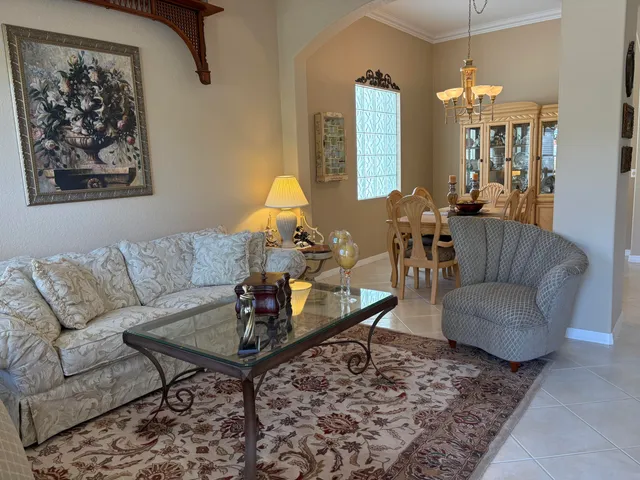 a living room with furniture and a rug