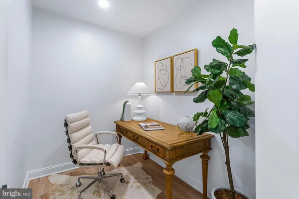 a view of a workspace with furniture
