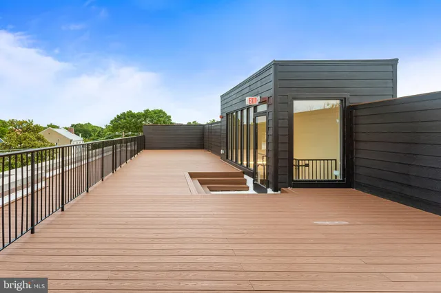 a view of a balcony with wooden floor