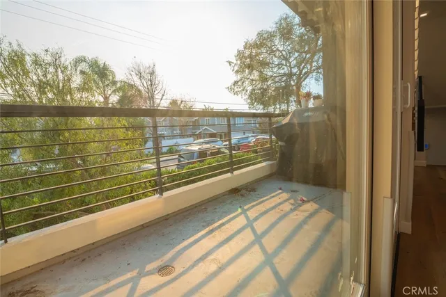 a view of a livingroom with a ceiling fan and window