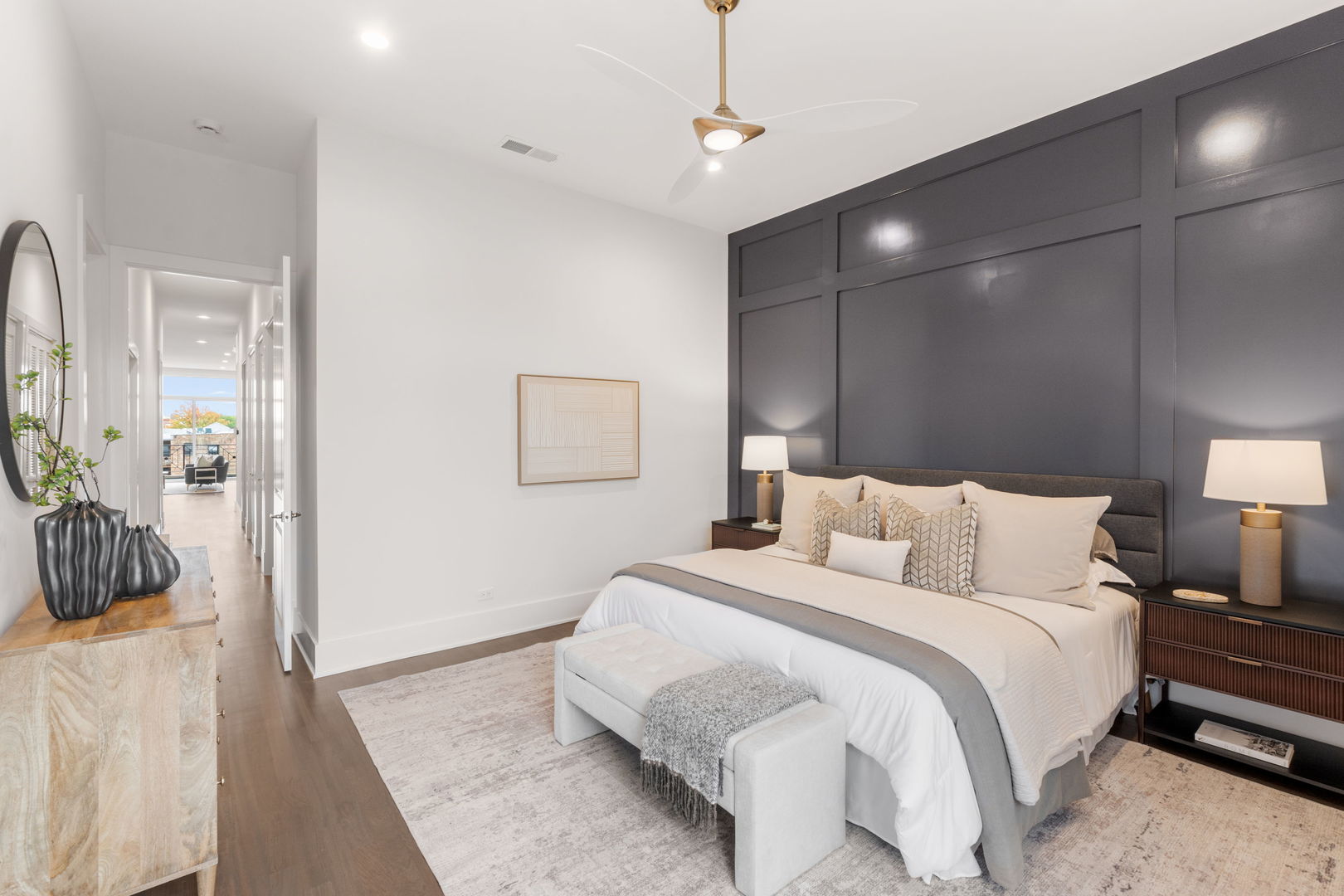 1426 West Irving Park Road, Unit 4 Chicago, IL 60613 - Photo 13 of 19 a bedroom with a bed a lamp and a chandelier