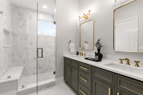 a bathroom with a shower sink and mirror