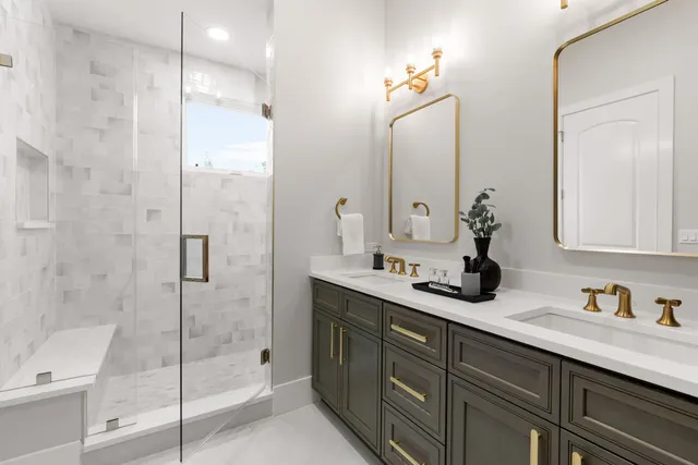 a bathroom with a shower sink and mirror