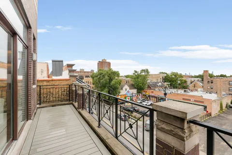 a view of a balcony with city view