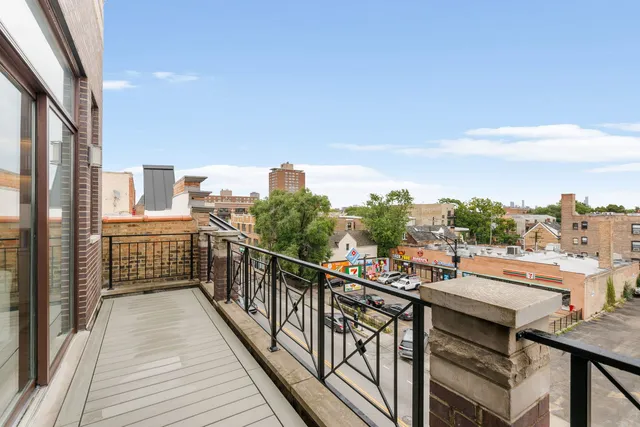 a view of a balcony with city view