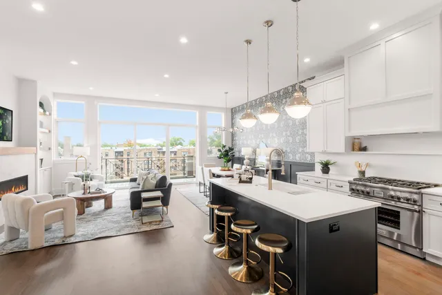 a kitchen with counter top space a sink appliances and cabinets