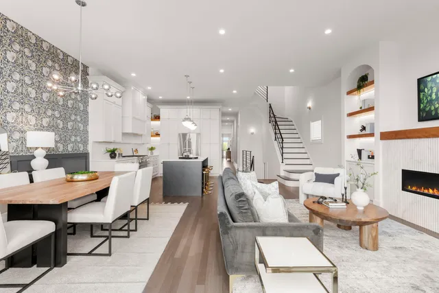 a large kitchen with a table and chairs