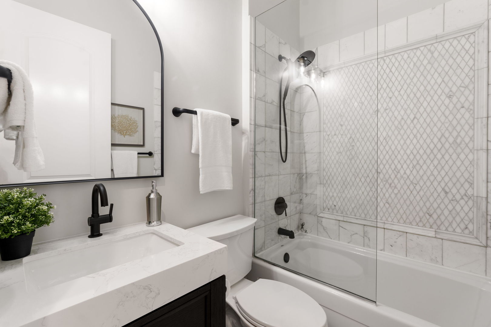 1426 West Irving Park Road, Unit 4 Chicago, IL 60613 - Photo 10 of 19 a bathroom with a sink a toilet and shower