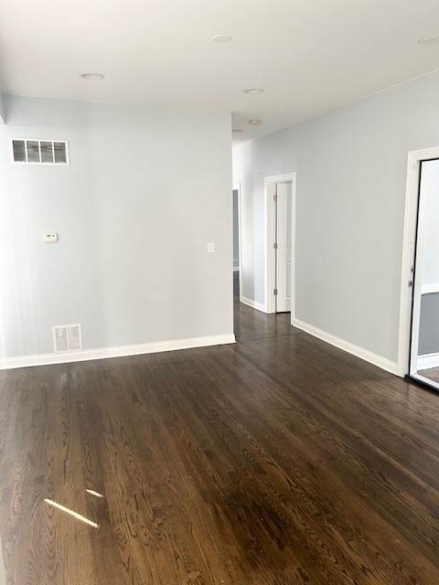 627 East 89th Place, Unit 2 Chicago, IL 60619 - Photo 9 of 9 an empty room with wooden floor