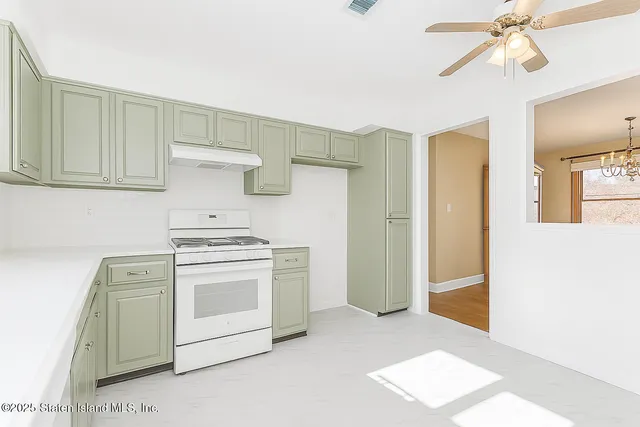 a kitchen with a stove and a refrigerator