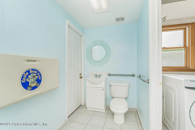 a bathroom with a toilet a sink and a shower