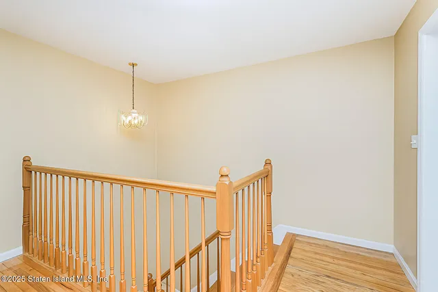 a view of a hallway with stairs