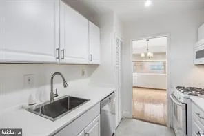 a kitchen with a sink and a refrigerator