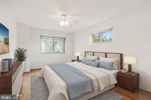 a bedroom with bed and a night stand