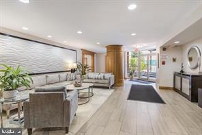 3900 Tunlaw Road Northwest, Unit 305 Washington, DC 20007 - Photo 3 of 32 a living room with furniture and a large window