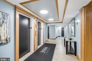 a hallway with dining area and glass doors