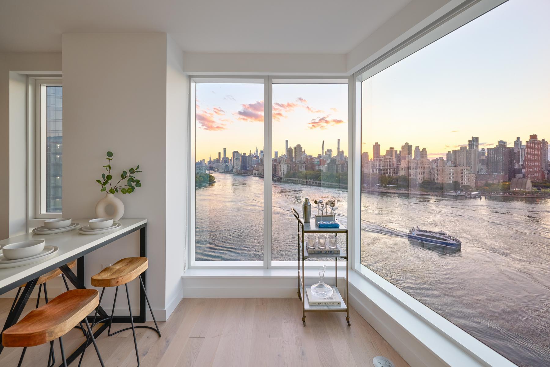 a view of a living room and a floor to ceiling window