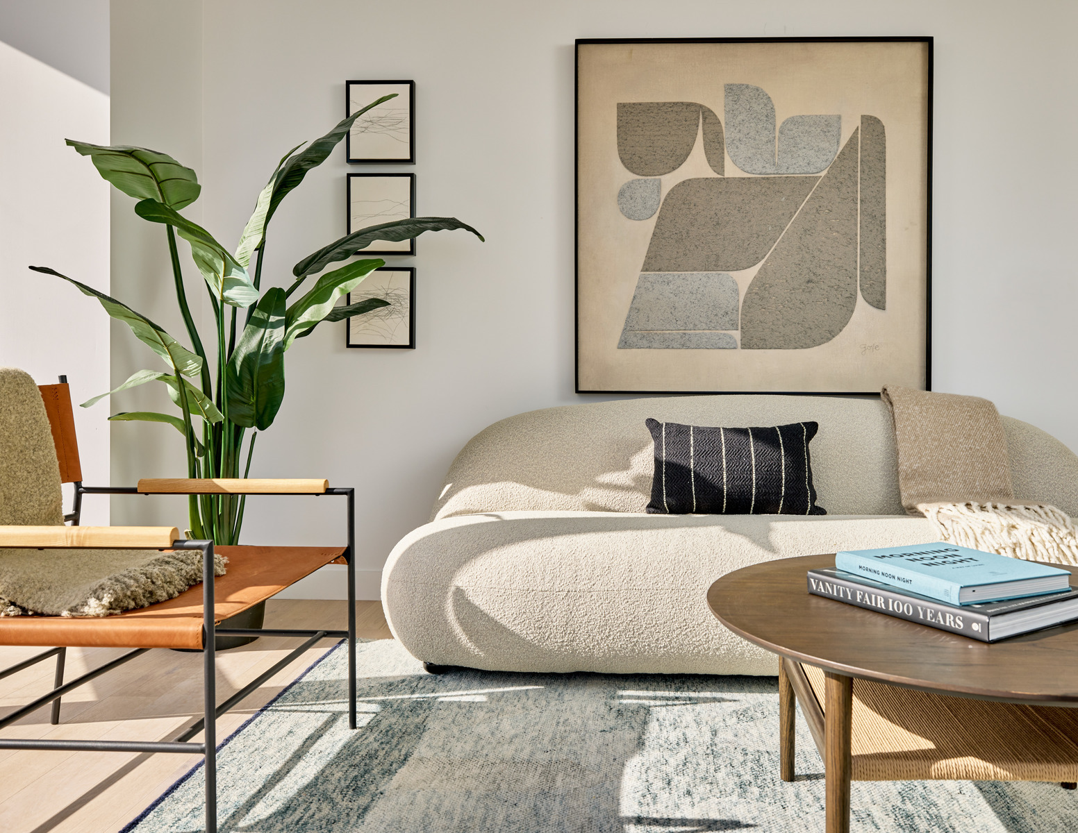 20 Halletts Point, Unit 22405 Queens, NY 11102 - Photo 12 of 47 a living room with furniture and a potted plant