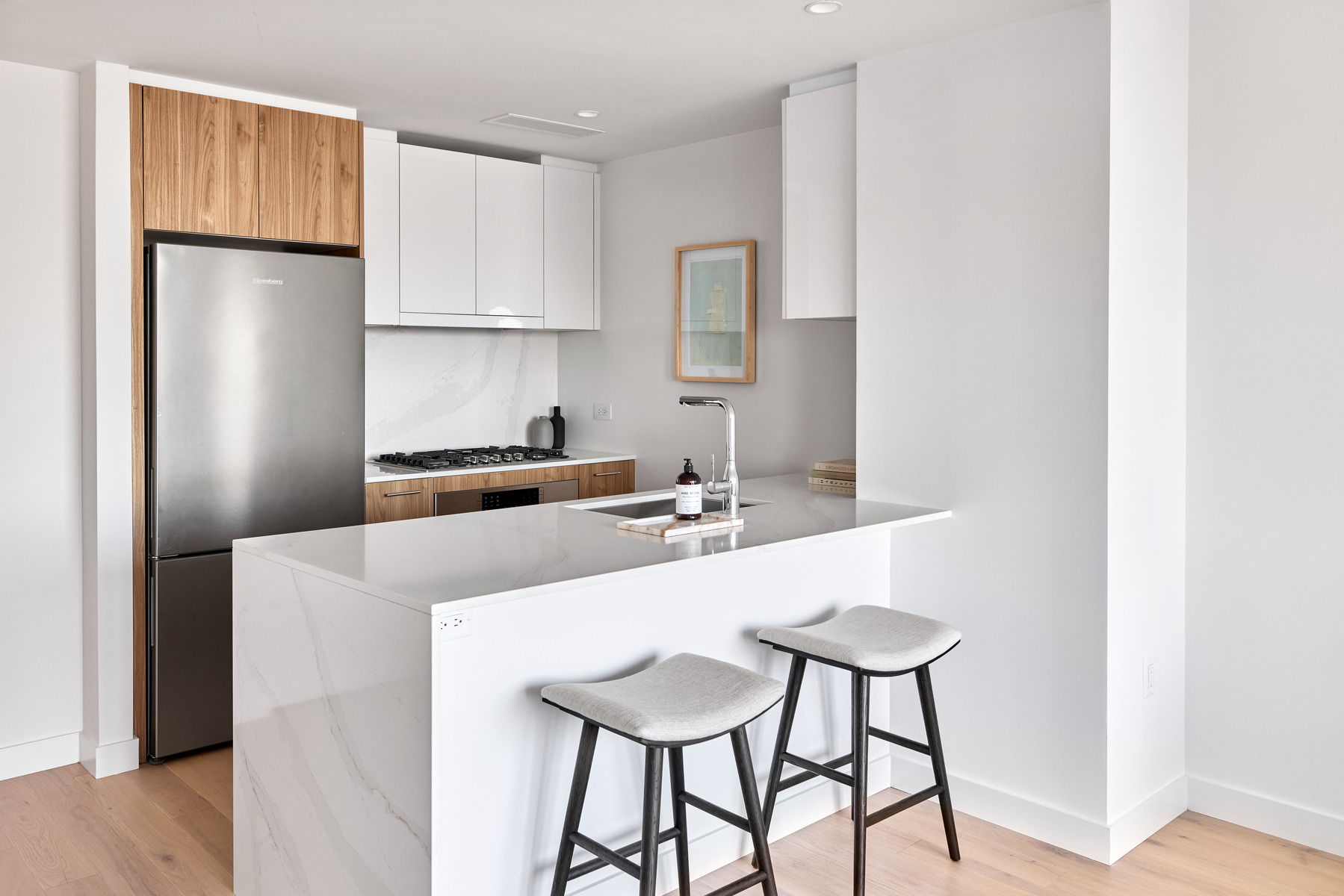 20 Halletts Point, Unit 22405 Queens, NY 11102 - Photo 22 of 47 a kitchen with stainless steel appliances a sink and cabinets