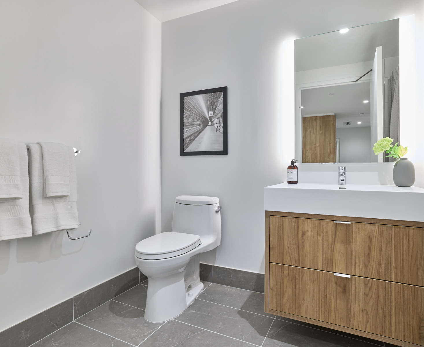 20 Halletts Point, Unit 22405 Queens, NY 11102 - Photo 25 of 47 a bathroom with a sink toilet and a mirror