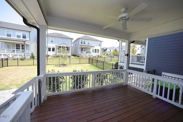 a view of a balcony with wooden floor