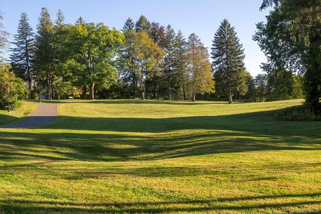 a view of a swimming pool with an outdoor space and seating area