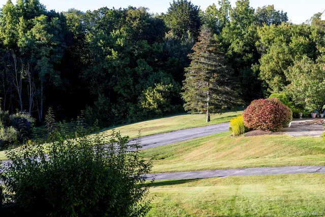 a view of a swimming pool with an outdoor space and seating area