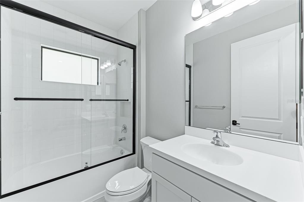 4191 Pegasus Way Naples, FL 34120 - Photo 30 of 48 a bathroom with a sink toilet and shower