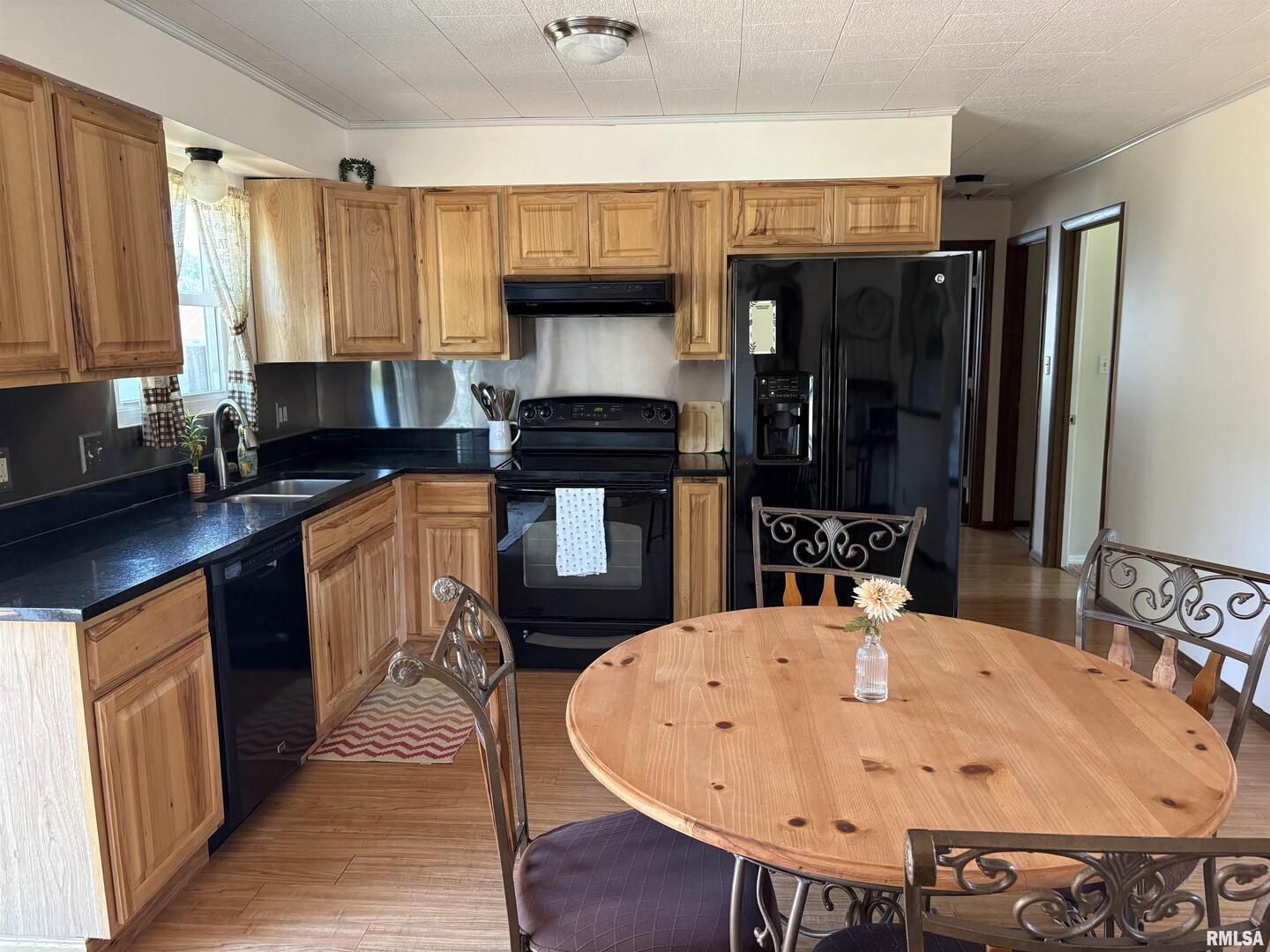100 North 35th Street Herrin, IL 62948 - Photo 16 of 35 a kitchen with a table chairs and a sink
