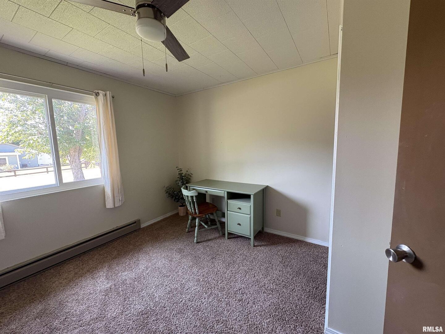 100 North 35th Street Herrin, IL 62948 - Photo 23 of 35 a view of a workspace with furniture and a window