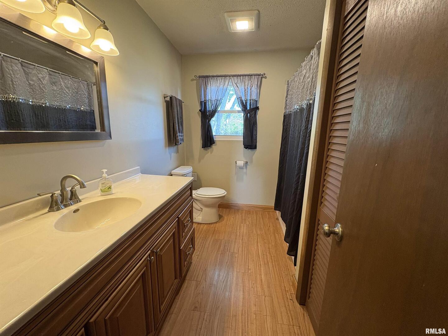 100 North 35th Street Herrin, IL 62948 - Photo 24 of 35 a bathroom with a sink and a mirror