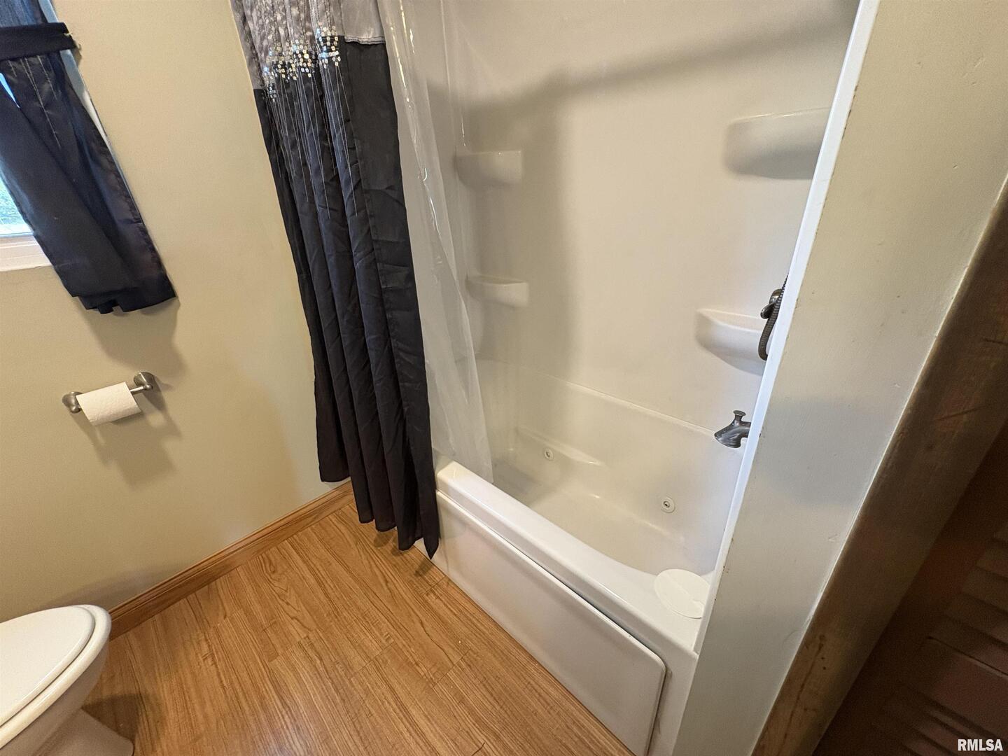 100 North 35th Street Herrin, IL 62948 - Photo 25 of 35 a bathroom with a sink a toilet a tub and shower