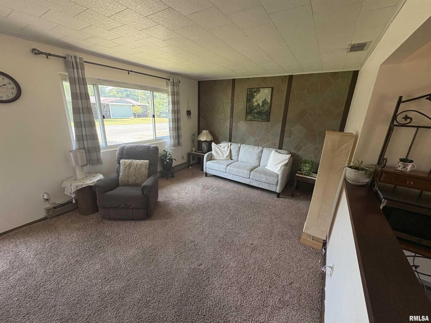 100 North 35th Street Herrin, IL 62948 - Photo 7 of 35 a living room with furniture and a flat screen tv