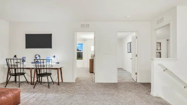 a view of a livingroom with furniture and a flat screen tv