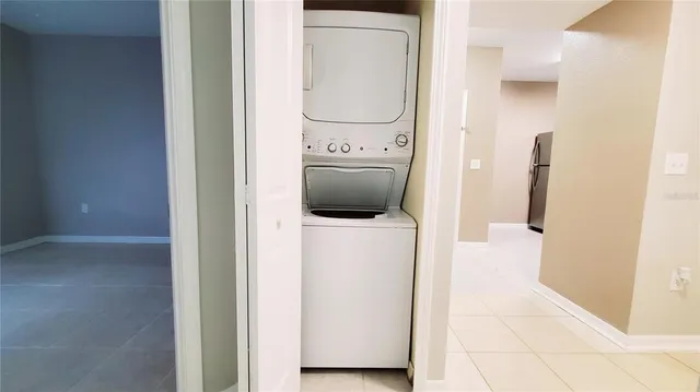 a view of a hallway with washer and dryer