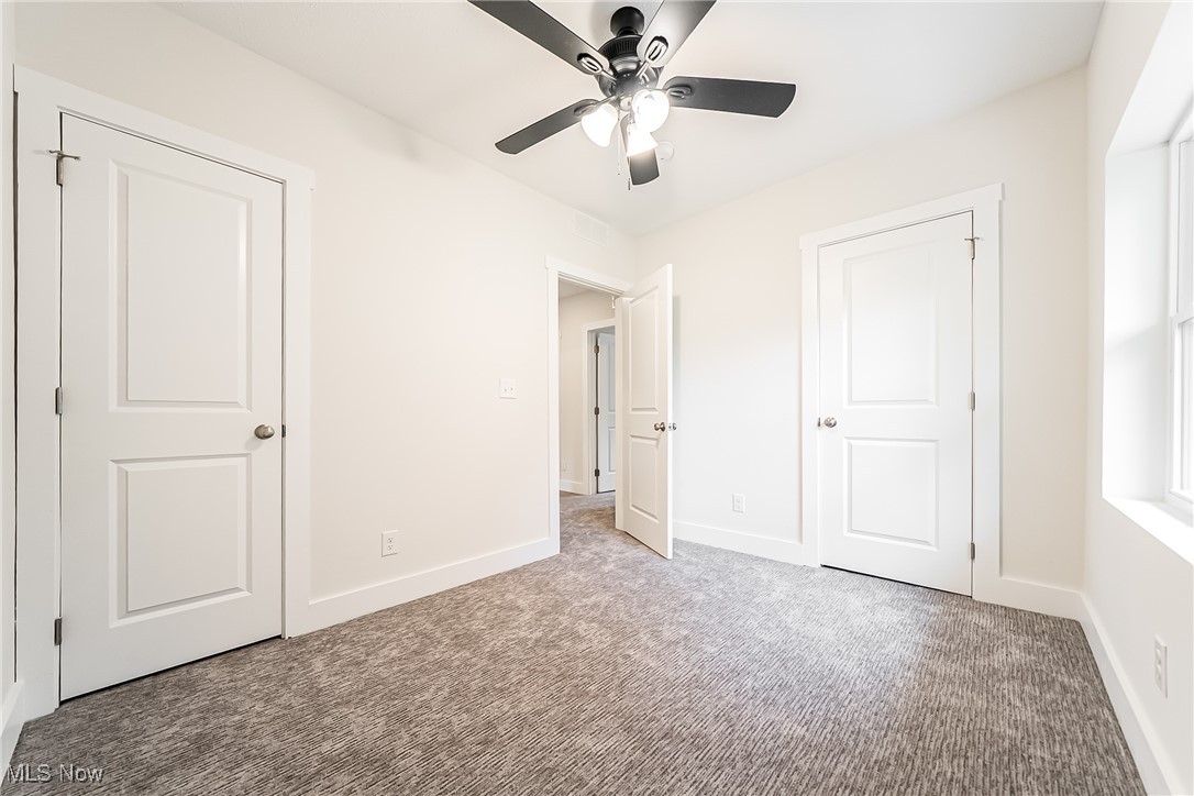 1839 Farmington Road Cleveland, OH 44112 - Photo 17 of 29 Bedroom featuring carpet floors and a ceiling fan