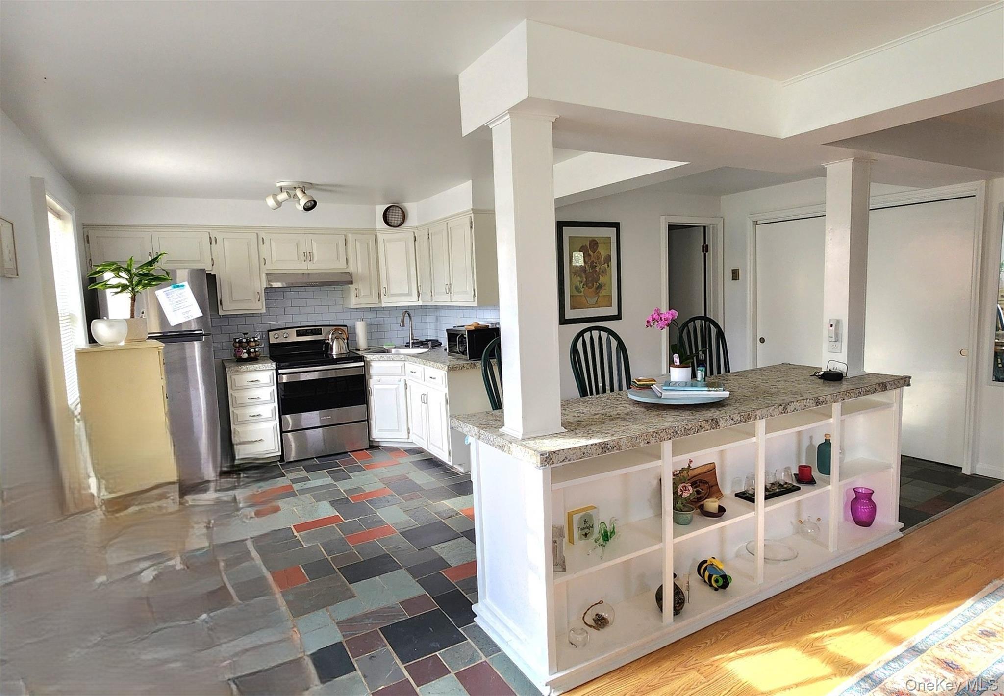 12 Traver Road Staatsburg, NY 12580 - Photo 2 of 11 a kitchen with stainless steel appliances granite countertop a sink and a refrigerator