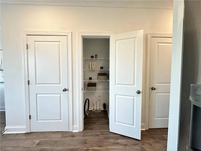 a view of a bathroom with wooden floor