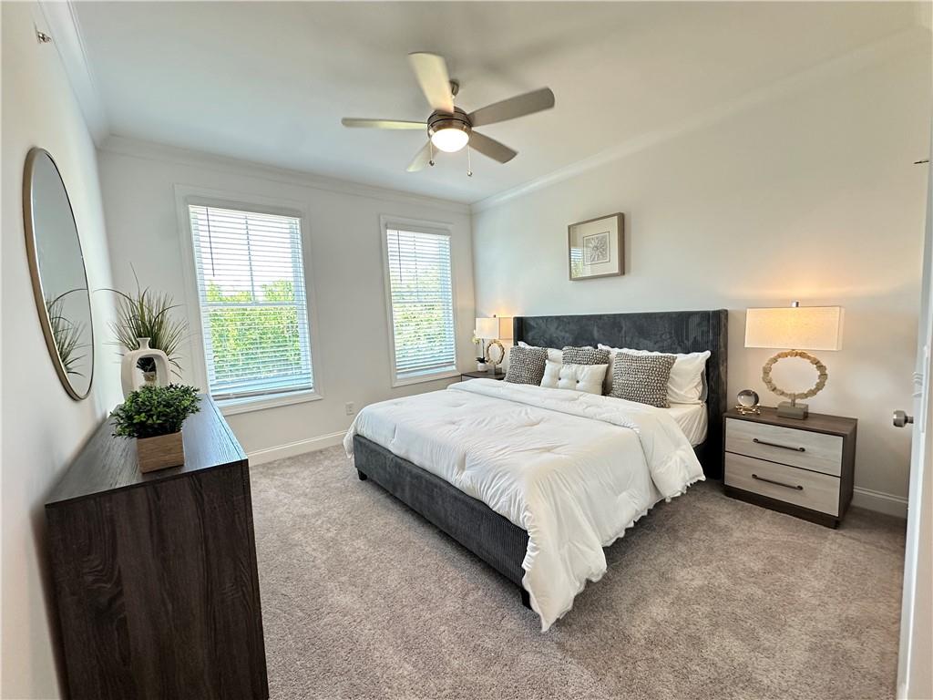 530 Alice Way, Unit D7 Cumming, GA 30040 - Photo 21 of 56 a bedroom with a bed and window